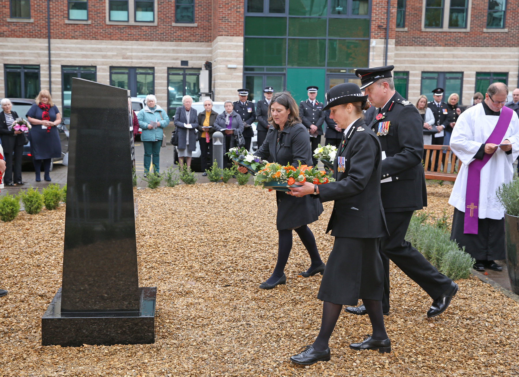 Julia Mulligan, Lisa Winward and Jonathan Foster ( Dep Chief Fire Officer) present wreaths.