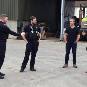 Damon Rodwell explains how perimeter alarms work to local farmer and Rural Task Force officers.