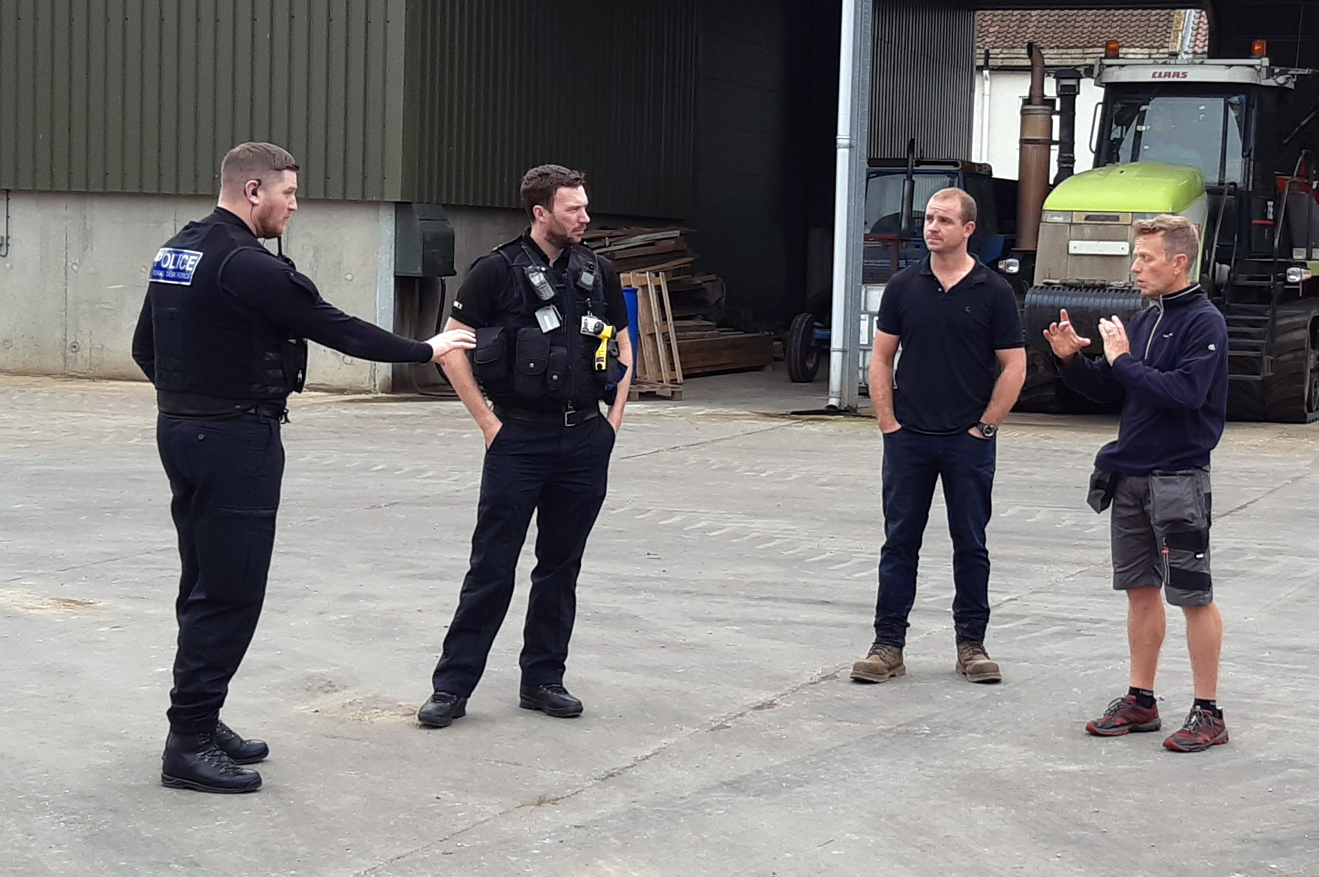 Damon Rodwell explains how perimeter alarms work to local farmer and Rural Task Force officers.