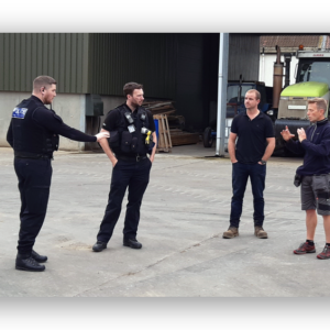 Damon Rodwell explains how perimeter alarms work to local farmer and Rural Task Force officers.