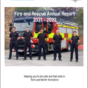 Fire and Rescue Annual Report - front cover - Fire fighters standing in front of fire engine