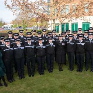 Police officers group together for a formal photo
