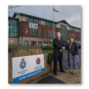 Tim Forber and Commissioner Zoe standing outside Joint services HQ