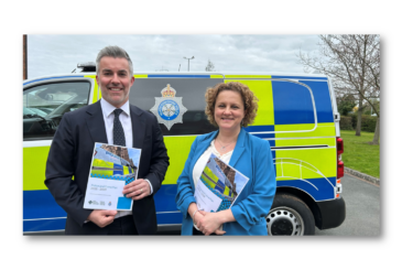 Mayor David Skaith and Deputy Mayor Jo Coles standing in front of police vehicle, holding the Police and Crime Plan