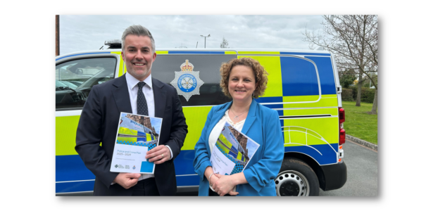 Mayor David Skaith and Deputy Mayor Jo Coles standing in front of police vehicle, holding the Police and Crime Plan